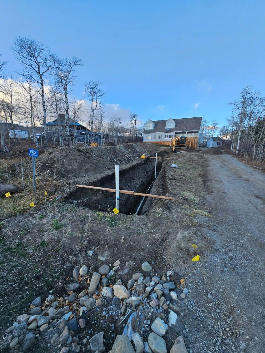 Open utility trench at residential site